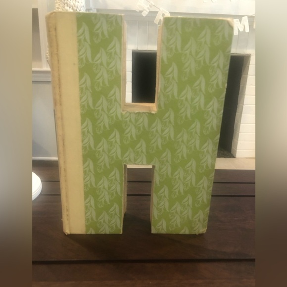 Anthropologie: Hand cut letters from Reader’s Digest books. Spells out “HOME.” - Picture 4 of 15